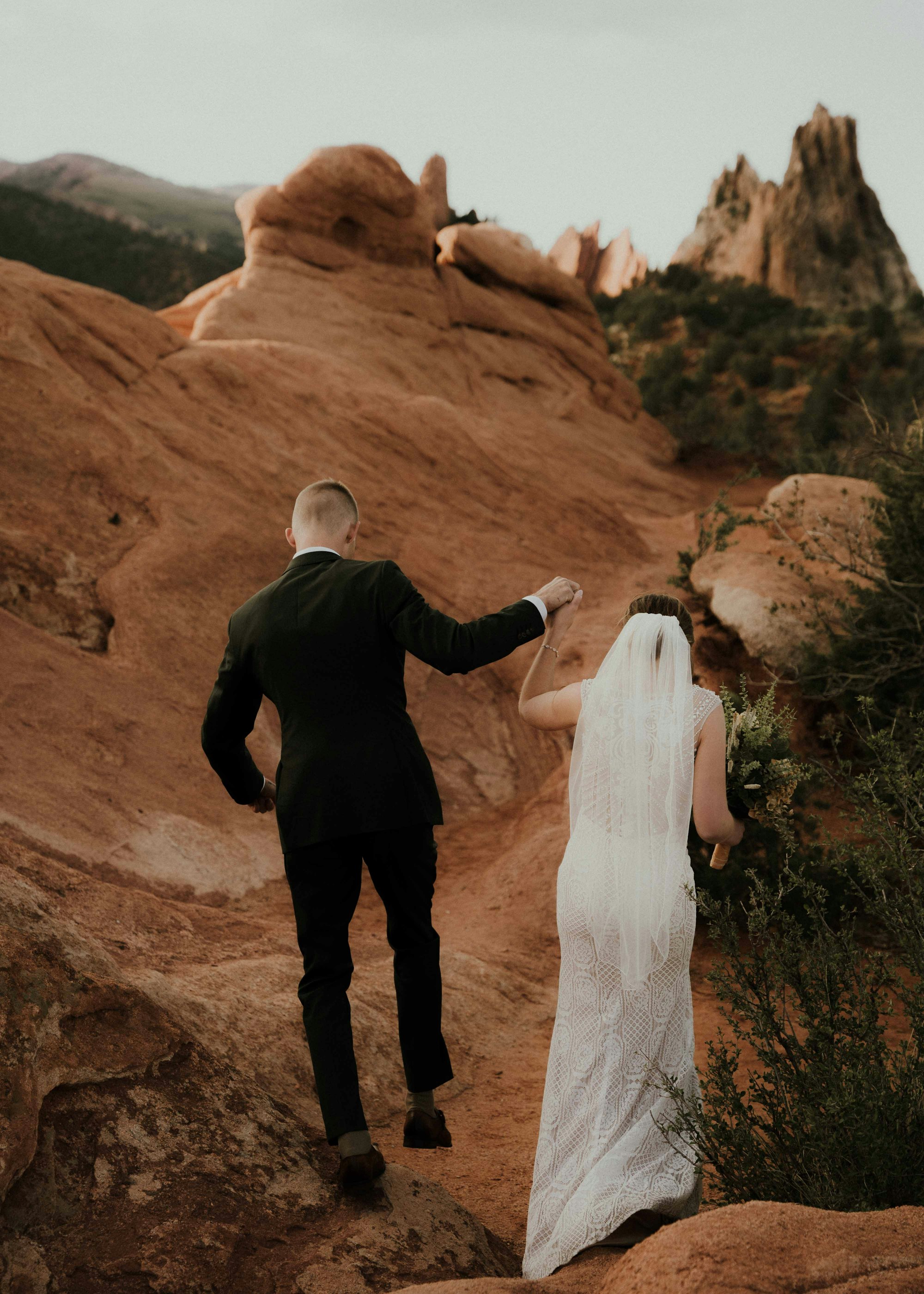 PLACEHOLDER (Unsplash) — couple walking on a rocky path