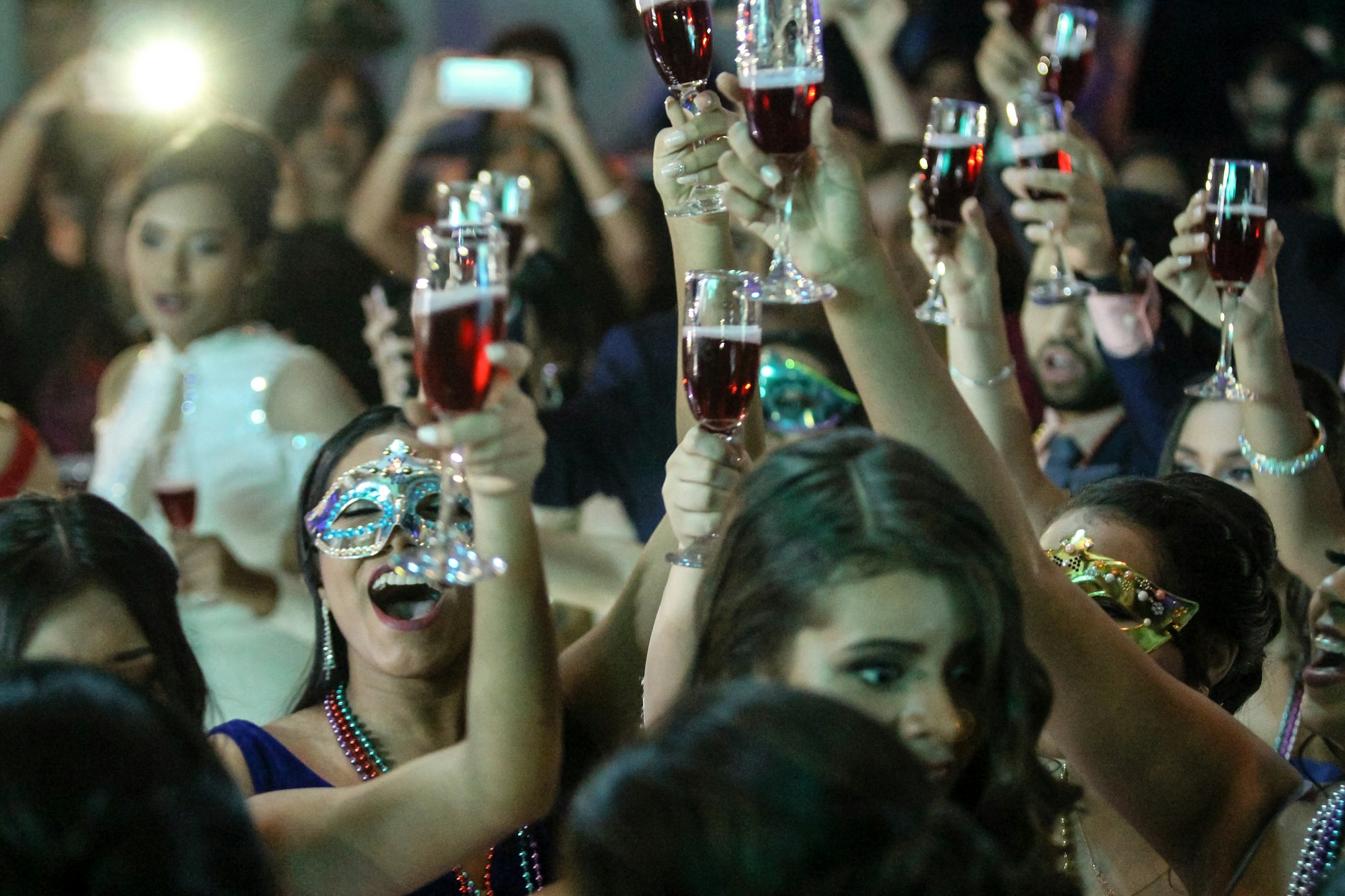 PLACEHOLDER (Unsplash) — women raising champagne flutes