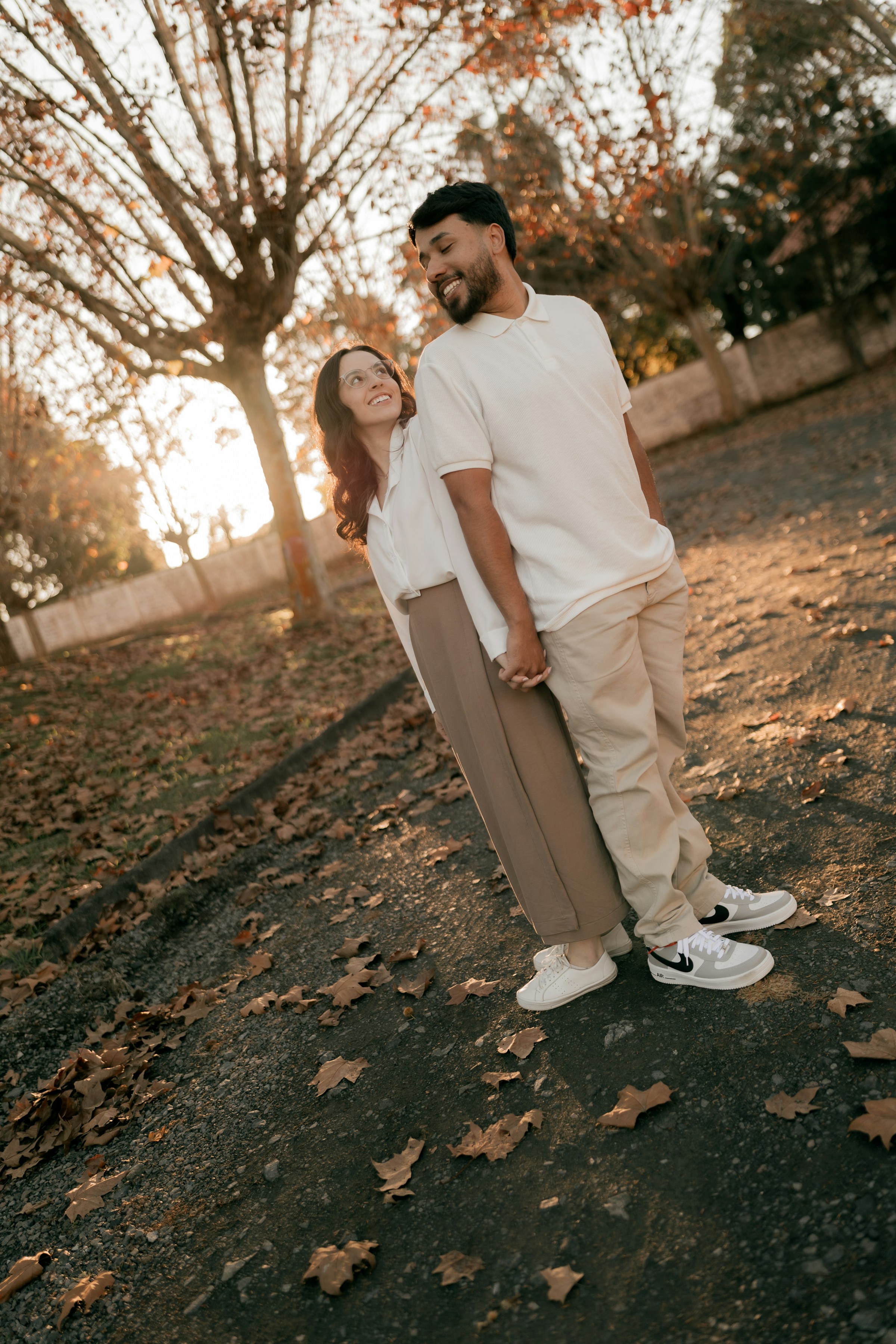 PLACEHOLDER (Unsplash) — couple holding hands outdoors at golden hour